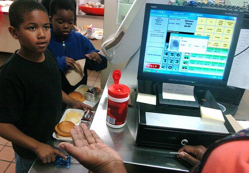 Second-grader Antwain Williams, 8, has his fingerprint scanned in the cafeteria at Pine Crest Elementary in Sanford